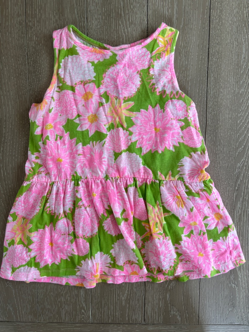 Lilly Pulitzer Pink Floral Peplum Dress on Green Background